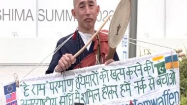World News | Buddhist Monk Holds Protest Outside G7 International Media Centre in Hiroshima, Calls for Shunning Use of Nuclear Weapons