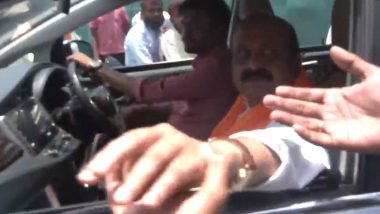 Basavaraj Bommai Convoy Gets Stuck as Congress Workers Celebrate on Road in Haveri After Party's Victory in Karnataka Assembly Elections 2023 (Watch Video)