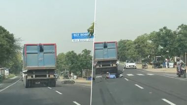 Horrifying Accident Caught on Camera in Gurugram: Man Miraculously Survives After Truck Hits Bike and Throws Him Under Another Truck in Farrukhnagar, Month-Old Video Goes Viral
