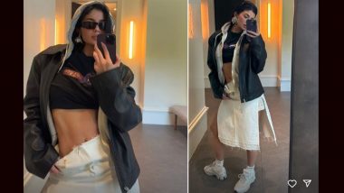 Kylie Jenner Sizzles in Stylish Ensemble: Rocking a Trendy Jacket, Side-Cut Skirt, and Super Cool Sneakers in Mirror Selfie (View Pic)