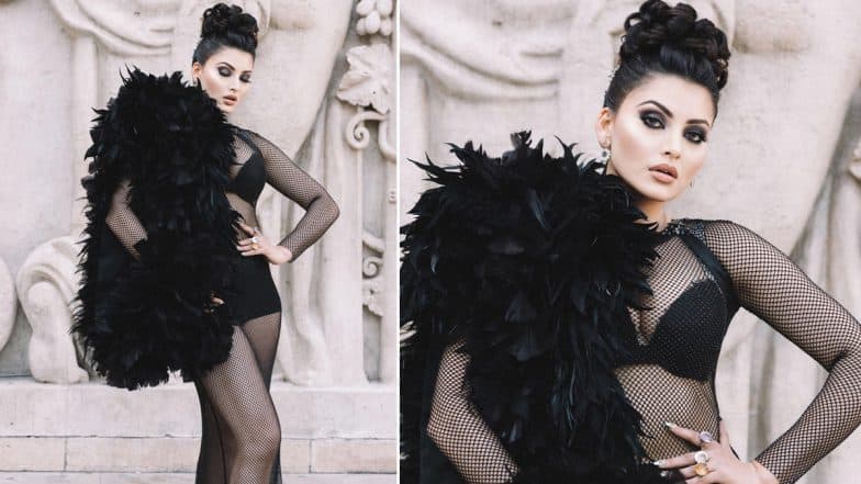 Urvashi Rautela Flaunts Her Figure for Paris Fashion Week in Sophisticated Black Net Dress, Top Bun and Dramatic Feather Sleeve (View Pics)