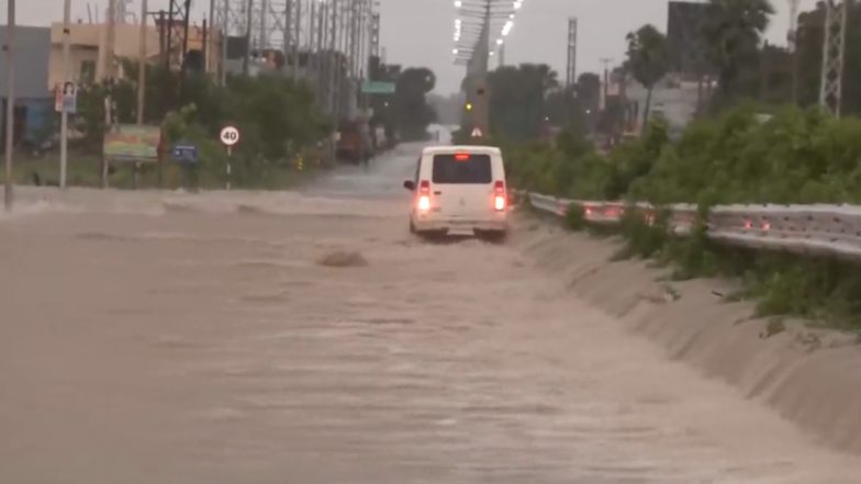 Telangana Floods Videos: Part of NH-163 Bridge in Mulugu Flooded Due Incessant Rain, Four-Wheeler Stuck on Waterlogged Route