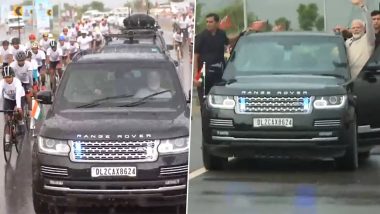 PM Modi Roadshow in Rajasthan Video: Cyclists Join in Prime Minister Narendra Modi's Rally Amid Rains in Bikaner