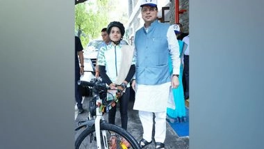 India News | Uttarakhand CM Dhami Meets Cyclist Asha Malviya, Who is on Nationwide Tour for Women's Safety, Empowerment