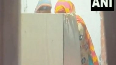 India News | WB: In Viral Clip, Woman Purportedly Seen Helping Voter Inside Polling Booth