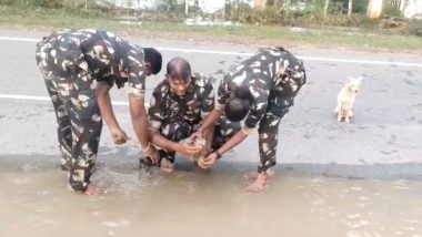 Dogs Rescued From Water Video: Andhra Pradesh Police Rescue Stranded Puppies From Floodwater After Mother Dog Follows Cops for Help, Heartwarming Clip Goes Viral