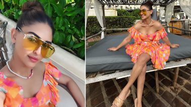 Krystle Dsouza Showcases her Fashionable Travel Style In An Orange Off-Shoulder Dress (View Pics)
