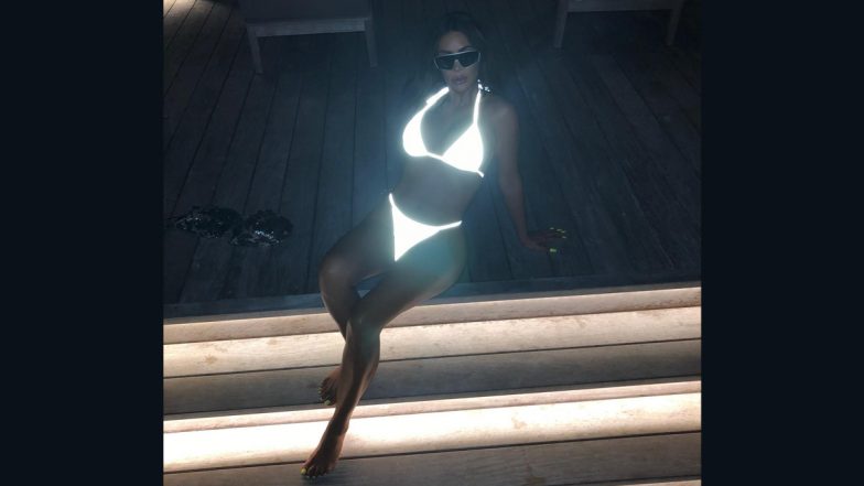 Kim Kardashian Looks Sultry in a Glow-in-the-Dark Bikini As She Poses on Pool Stairs (See Pic)