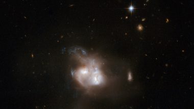 'Merging Galaxies': NASA's Hubble Telescope Shares Captivating Image of Two Merging Galaxies Located 350 Million Light Years From Earth (See Pic)