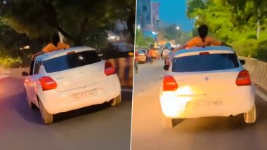 Man Performs Dangerous Stunt While Resting on Roof of Moving Car, Noida Traffic Police Slaps Rs 26,000 Fine (Watch Video)