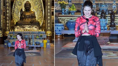 Yuvika Chaudhary Vacays in Vietnam, Poses Inside a Pagoda in Red Pritned Top and Black Baggy Pants