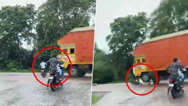 Freaky 'Accident' as Biker Talking on Mobile Gets Struck by Speeding Truck, Viral Video Shows Dangers of Using Phone While Riding