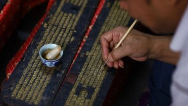 World News | Artists in Nepal Repaint Buddhist Manuscript with Gold as Religious Rituals Halted for Month
