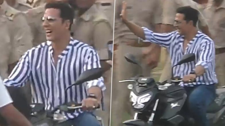 Sky Force: Akshay Kumar Greets Fans with Folded Hands, Waves Happily While Riding Motorcycle During Shoot of Upcoming Movie (Watch Video)