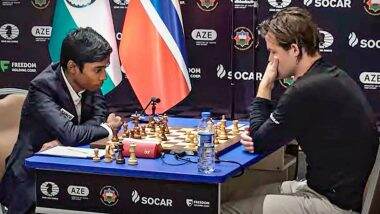 Rameshbabu Praggnanandhaa with Viswanathan Anand. Rameshbabu