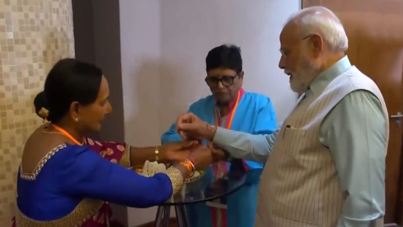 Raksha Bandhan With PM Modi: Arya Samaj South Africa President and Member of Indian Community Tie Rakhis to Prime Minister Narendra Modi in Johannesburg (Watch Video)