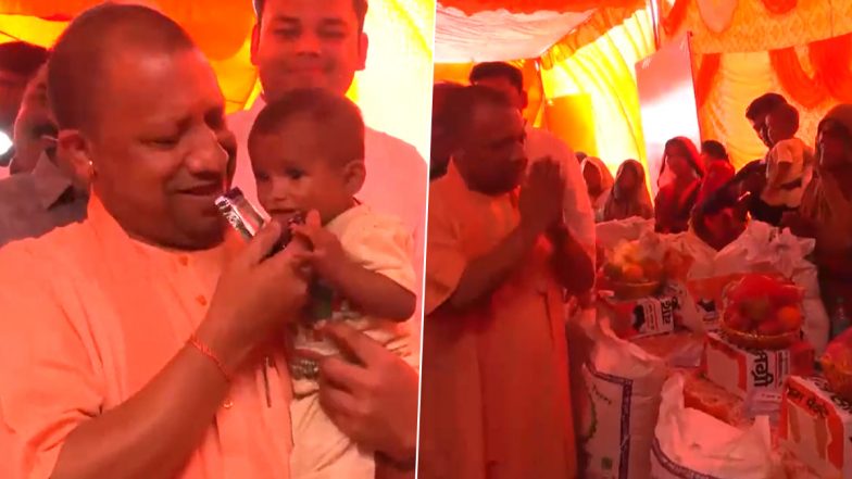 Uttar Pradesh CM Yogi Adityanath Feeds Chocolate to Kid, Distributes Relief Material To Flood-Affected Families at Camp in Kasganj (Watch Video)