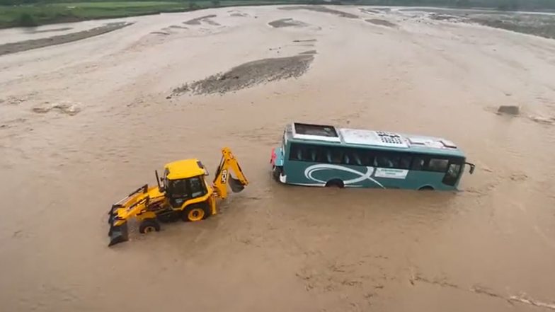 Bijnor: Narrow Escape for 53 Passengers After Bus Gets in Gushing Water in Kotawali River, JCB Deployed to Pull Out Stranded Vehicle (Watch Video)