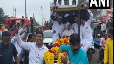 India News | MP: Congress Leaders, Including Farmers Take out Tractor Rally Protesting Acquisition of Farmers’ Land in Indore