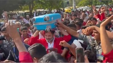 India News | Congress MP Rahul Gandhi Hears Grievances of Porters at Anand Vihar ISBT