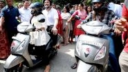 India News | Rahul Gandhi Rides Pillion On&nbsp;girl Student&rsquo;s Scooter in Jaipur