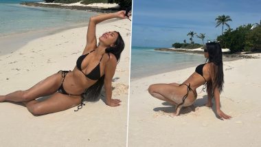 Kim Kardashian Relaxes on the Beach in a Skimpy Black Bikini! Reality Star Flaunts Her Envious Curves in These Sultry Pics