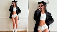 Olivia Rodrigo Stuns in White Bralette and Bummer Shorts Paired With an Oversized Coat (View Pic)