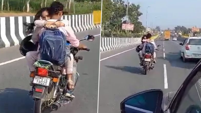 Couple Romance on Bike in UP: Viral Video Shows Woman Hugging Man on Moving Motorcycle on Hapur Road, Police Impose Rs 8,000 Fine on Biker