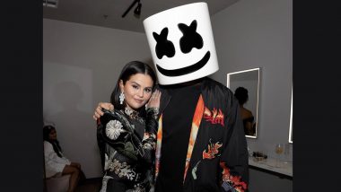 Selena Gomez rocks sleek bob and off-the-shoulder striped sweater dress  plugging Rare Beauty