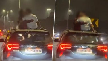 Couple Kissing in Hyderabad Video: Man and Woman Indulge in Passionate Lip-Lock While Standing Out of Sun-Roof of Moving Car, Clip of Dangerous 'Stunt' Surfaces