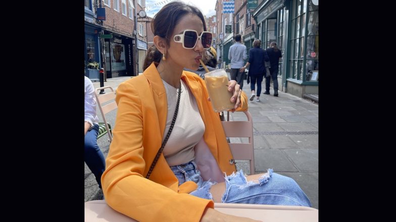 Rakul Preet Singh Takes a Stylish Coffee Break in Poppy Orange Overcoat Paired With White Tank Top (View Pic)