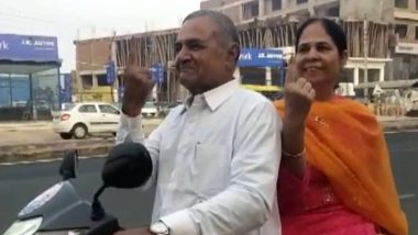 Rajasthan Assembly Elections 2023 Polling: BJP MP Subhash Chandra Baheria and Wife Ride Two-Wheeler to Cast Votes in Bhilwara (Watch Video)