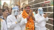 India News | Congress Candidate Sanjay Shukla Campaigns for Upcoming MP Assembly Polls Wearing PPE Kit in Indore