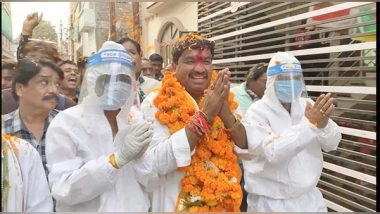 India News | Congress Candidate Sanjay Shukla Campaigns for Upcoming MP Assembly Polls Wearing PPE Kit in Indore