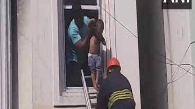 India News | Hyderabad Godown Fire: Woman, Child Pulled out of Window in Daring Rescue Operation