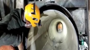 India News | Uttarkashi Tunnel Rescue: NDRF Demonstrates Movement of Wheeled Stretchers Through Pipeline