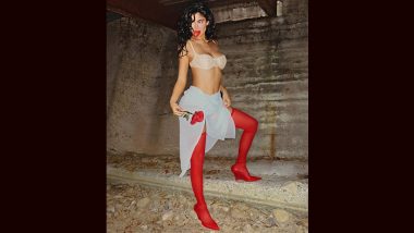Kylie Jenner Dishes Out Red Hot Fashion Goals in White Bra, Scarf Skirt, and Red Stockings (View Pic)