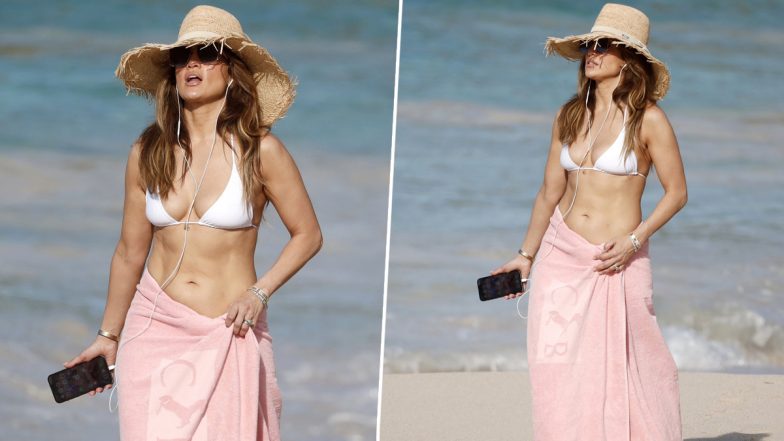 Jennifer Lopez Flaunts Her Abs in White Bikini Top With Towel Wrapped Around Her Waist! Check Out JLo’s Sexy Beach Pics Here