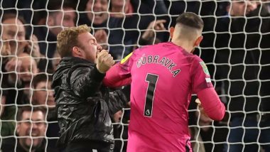 Newcastle United Goalkeeper Martin Dubravka Confronted by a Chelsea Fan on Field at Stamford Bridge in Carabao Cup 2023–24