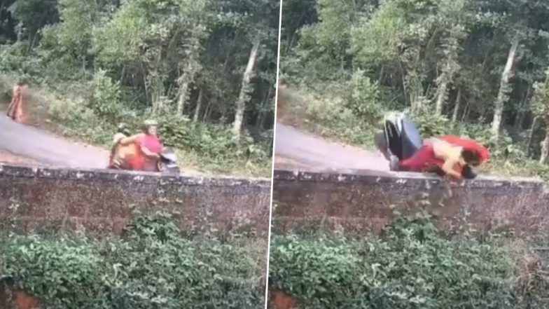 Woman Crashes Scooty Into a Wall, Leaving Her Friend Sitting Behind Fly Over the Wall! This Viral Video Will Leave You Part Concerned, Part Amused