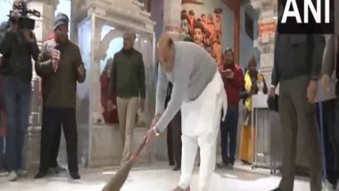 India News | Defence Minister Rajnath Singh Cleans Hanuman Setu Temple in Lucknow Ahead of Pran Pratishtha Event