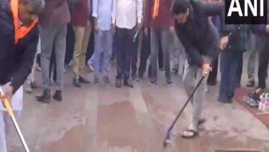 India News | Anurag Thakur Cleans Hanuman Temple Premises in Delhi's CP Ahead of Pran Pratishtha Event in Ayodhya