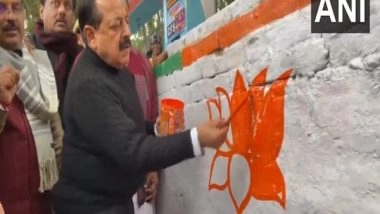 India News | Union Minister Jitendra Singh Paints Lotus Symbol at Mainpuri as Part of 'Wall Writing' Programme