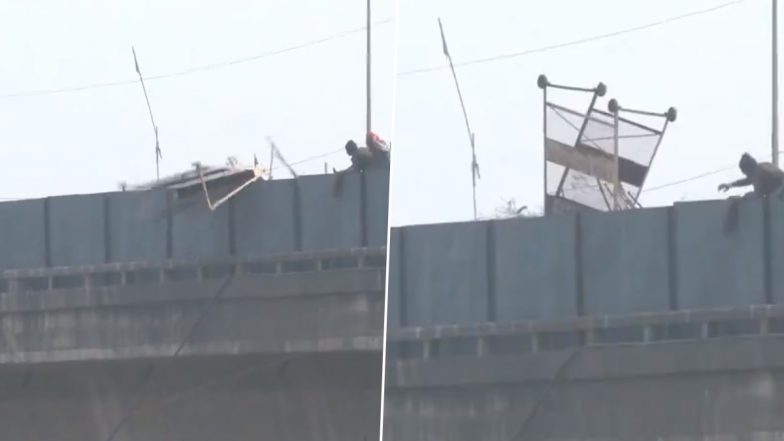 Farmers’ Delhi Chalo March: Protesting Farmers Vandalise Safety Barricades, Throw Them Down From Flyover at Shambhu Border, Police Use Water Cannons to Disperse Crowd (Watch Video)