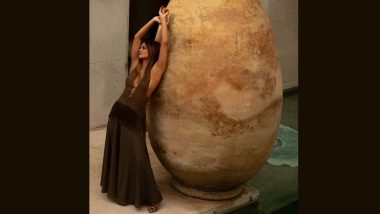Halle Berry Goes Braless in Low-Cut Halter Neck Top and Flowing Skirt; X-Men Star Poses Against a Large Stone Ornament (View Pic)