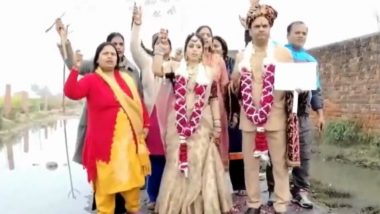 Unique Protest in Uttar Pradesh: Couple Celebrate Wedding Anniversary Near Drain To Protest Against Waterlogging Issue in Agra (Watch Video)
