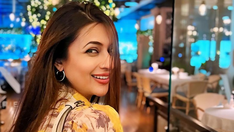 Divyanka Tripathi Visualises Sunshine and Manifests Memories As She Poses Happily in Yellow Dress With Floral Prints (View Pics)