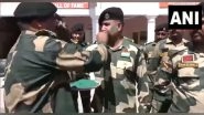 India News | J-K: BSF Jawans Smear Fellow Comrades with Colours During Holi Celebrations at International Border
