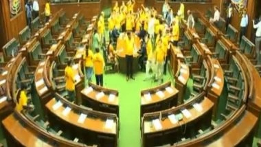 India News | AAP MLAs Don 'Mai Bhi Kejriwal' Yellow T Shirts in Delhi Assembly as They Protest Chief Minister's Arrest
