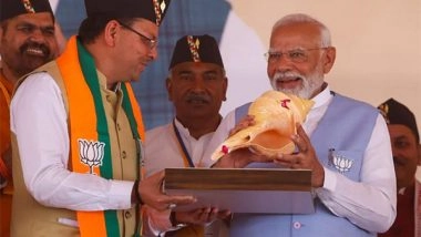 India News | Uttarakhand: CM Dhami Presents Conch to PM Narendra Modi During Rudrapur Rally